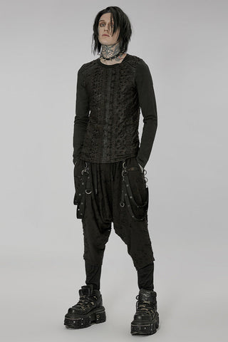 Full-body view of model wearing black dropcrotch pants with harness straps
