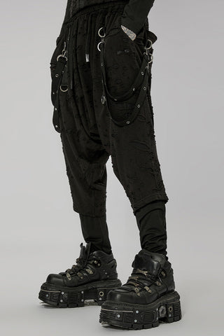 Side view of tactical black dropcrotch pants with D-ring details