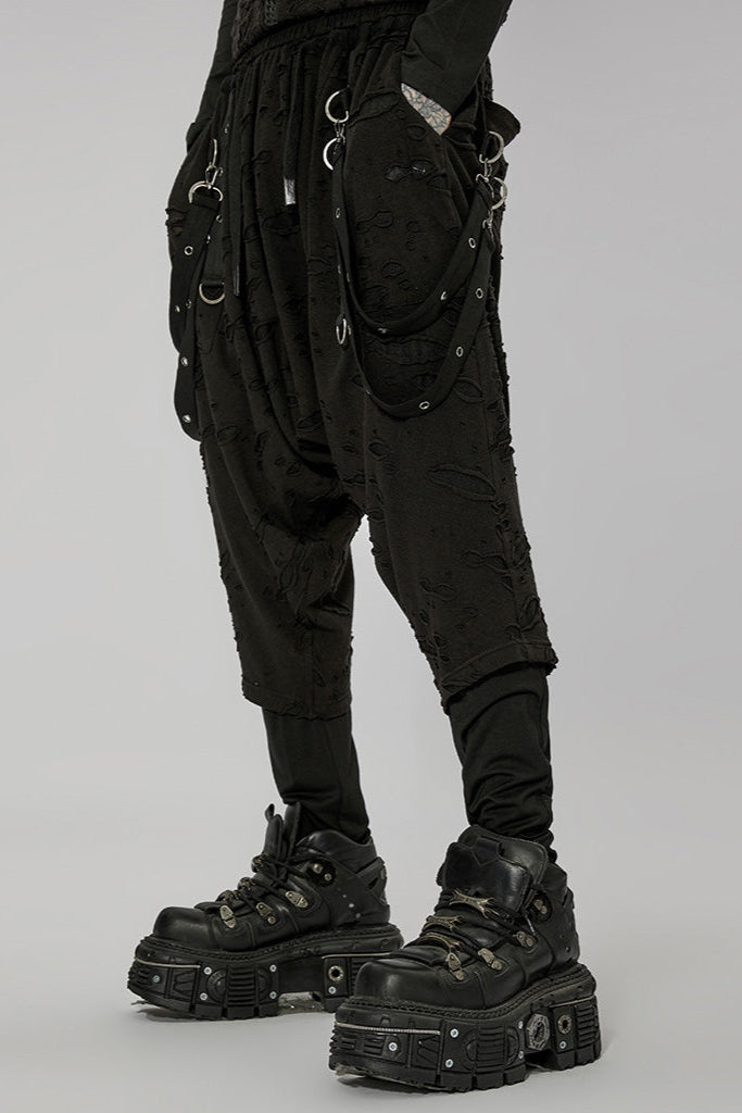 Side view of tactical black dropcrotch pants with D-ring details