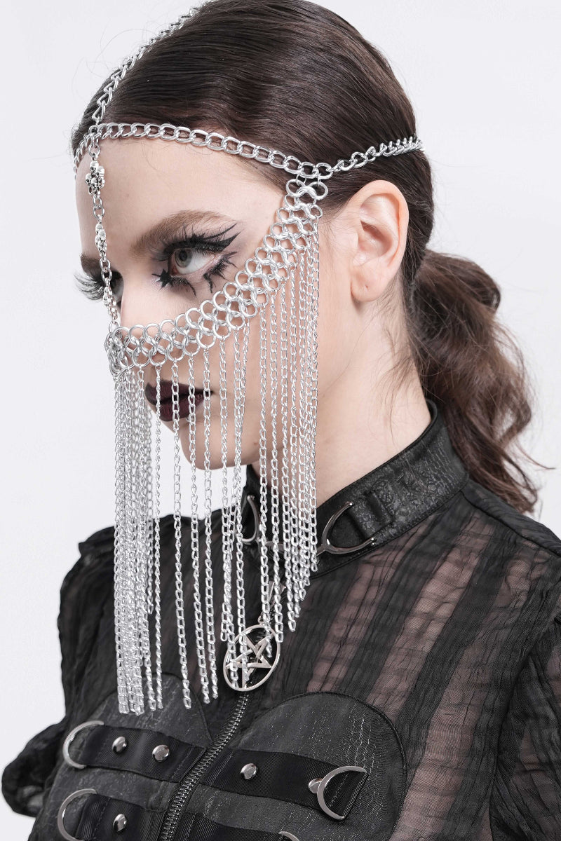 Side view of a model wearing a silver Gothic chain veil headpiece with layered chains and a vertical skull pendant.