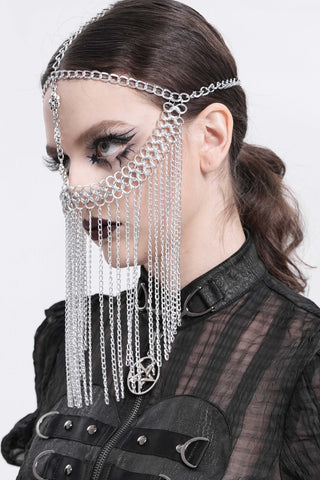 Side view of a model wearing a silver Gothic chain veil headpiece with layered chains and a vertical skull pendant.
