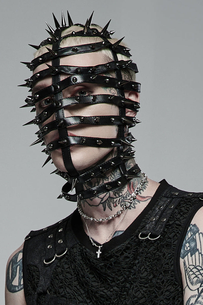 Angled view of model wearing spiked cage mask