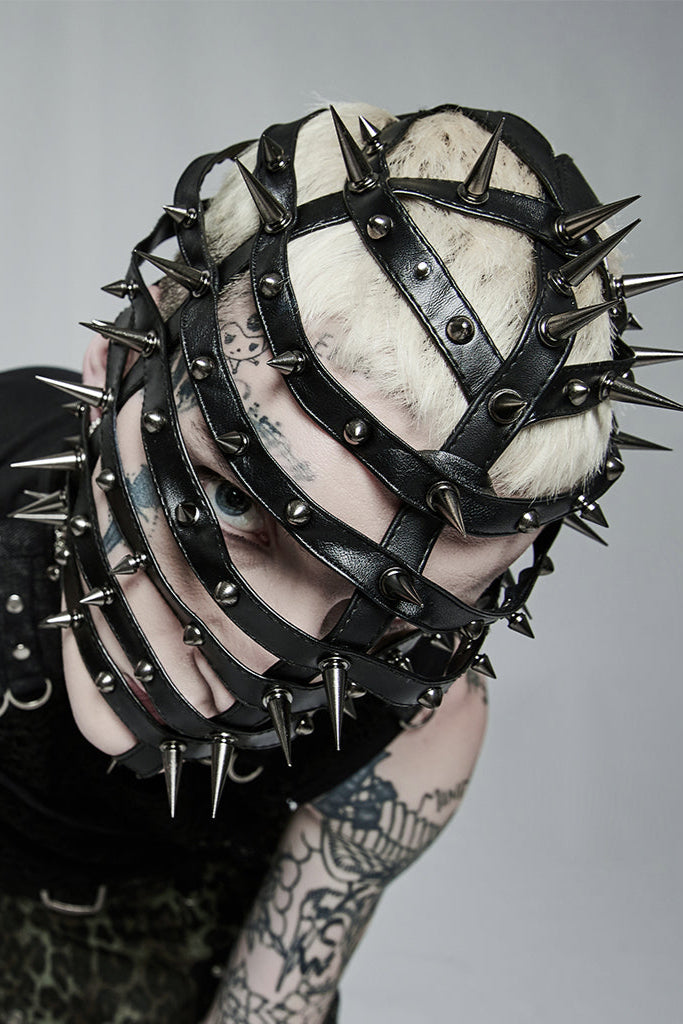 Overhead view showing crown and spike pattern of mask