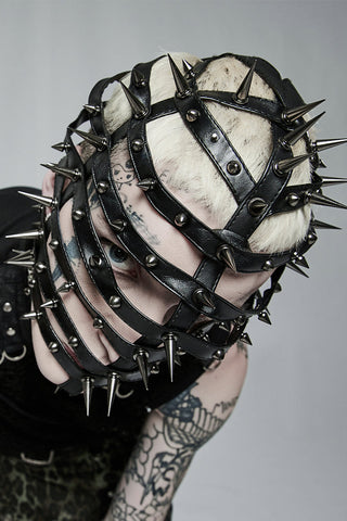 Overhead view showing crown and spike pattern of mask