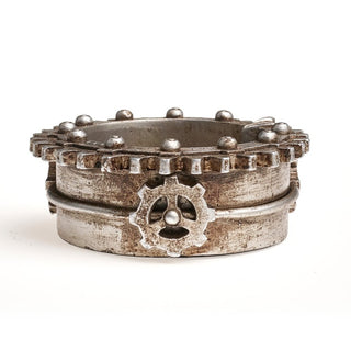 Side view of an antique silver steampunk gear trinket tray with cog and rivet details