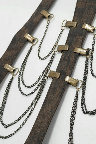 Close-up of layered metal chains on brown faux leather Steampunk harness