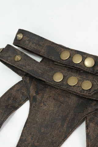 Rust-textured faux leather harness with brass studs and shoulder buckle detail