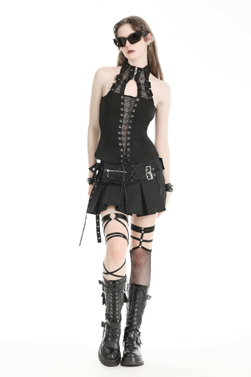  Model wearing a black techwear-inspired mini skirt with a detachable utility belt, lace halter top, and combat boots – styled for alt fashion or festivals.