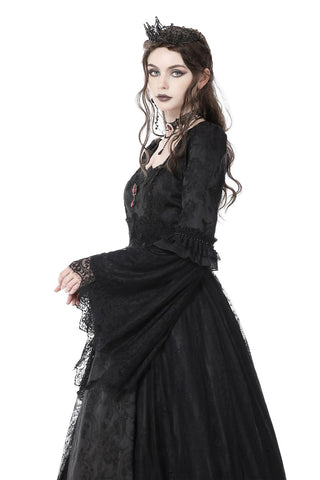 Side view of Gothic dress showing dramatic sleeve shape and skirt movement
