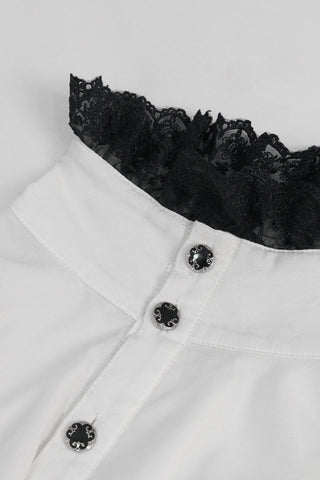 Close-up of white Victorian-style shirt collar with black lace trim and ornate black buttons