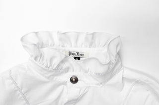 Ruffled high collar and metal button detail on white Gothic shirt