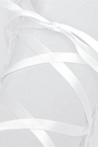 Close-up of white satin ribbon lacing on mesh bridal glove