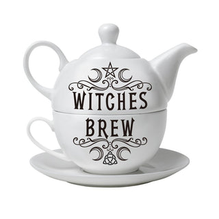Witches Brew teapot stacked over matching cup and saucer on a white background