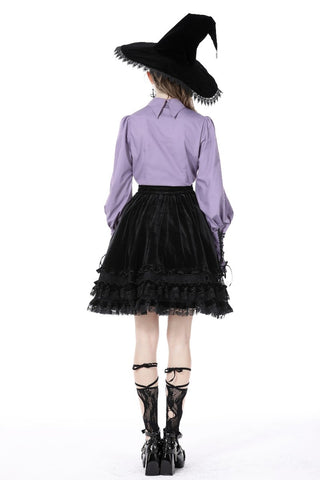 Model showing back of violet shirt and skirt, highlighting gathered sleeves and collar detail