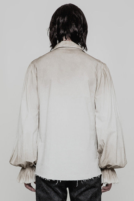 Back view of model wearing distressed white pirate-style shirt with gathered sleeves and loose fit