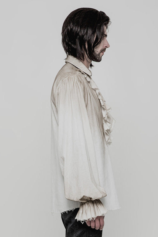 Side view of model wearing distressed off-white pirate-style shirt with ruffled chest and gathered 